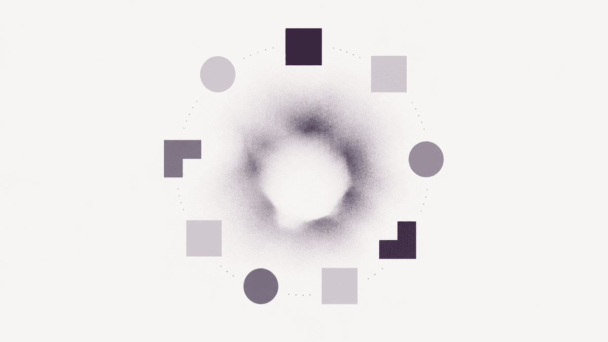 Geometric shapes arranged in a ring around a grainy, hollow center.
